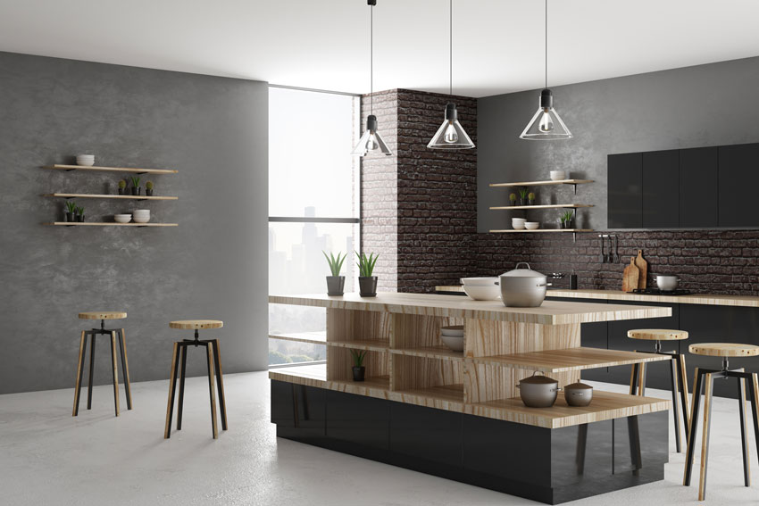 cucina dal mood moderno con isola nera e legno con spazio per ordinare piatti e pentole.