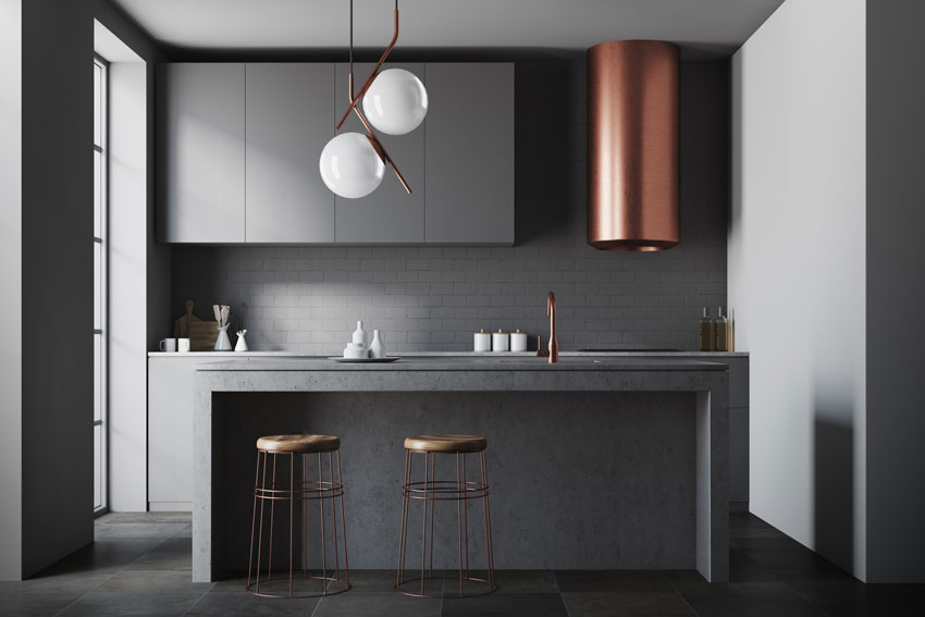 cucina grigia antracite dal design moderna con cappa in rame