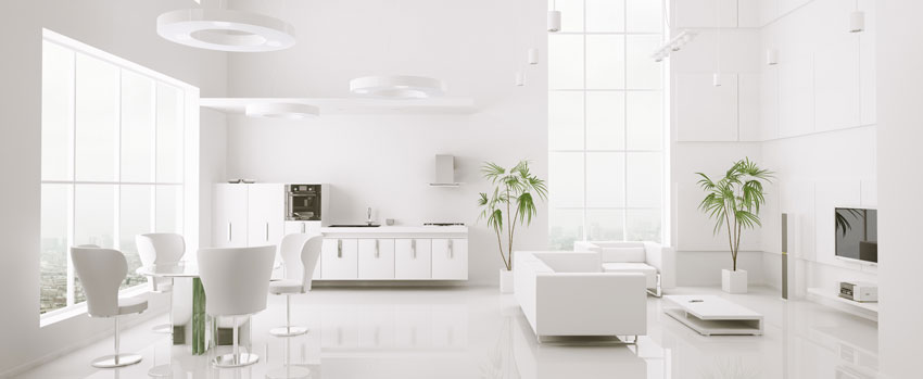 arredamento salotto total white con piante verde.