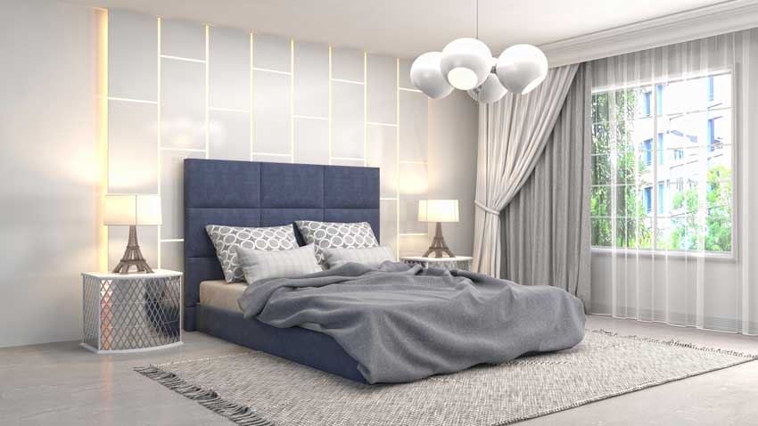 camera da letto moderna con testiera blu in stoffa, parete del letto con luci a led.