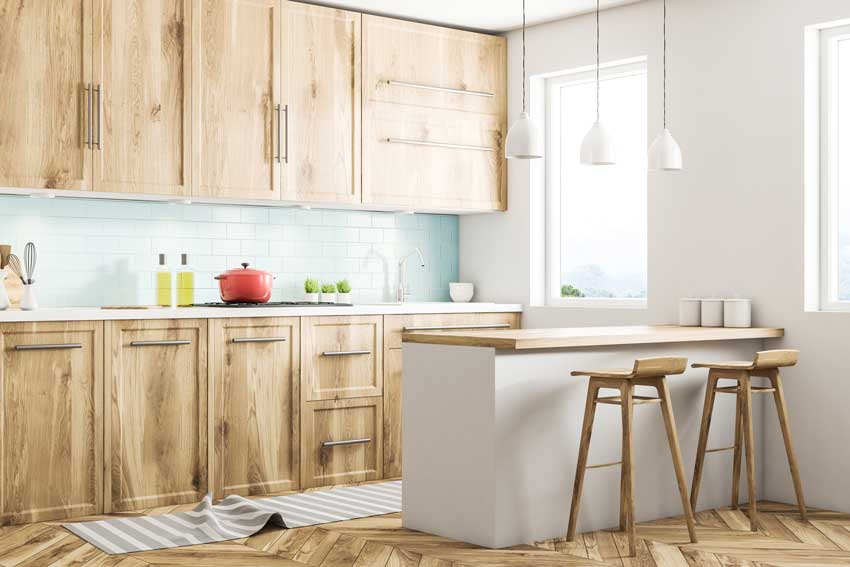 Le cucine con penisola in stile scandinavo sono semplicemente affascinante. Bellissimo il colore del legno.