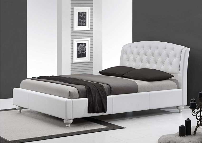 Camera da letto in stile moderno con pareti bianche e grigie.