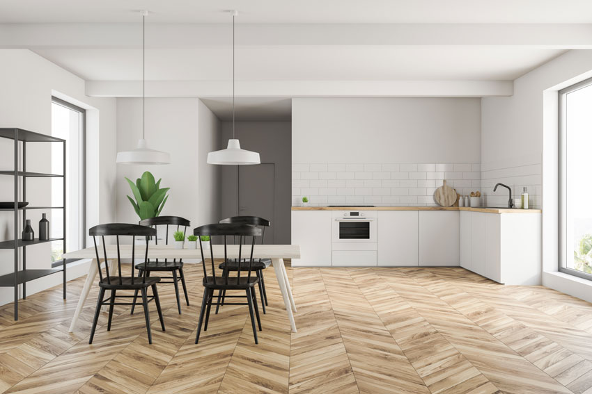 Esempio di una casa open space con cucina ad angolo e parquet.