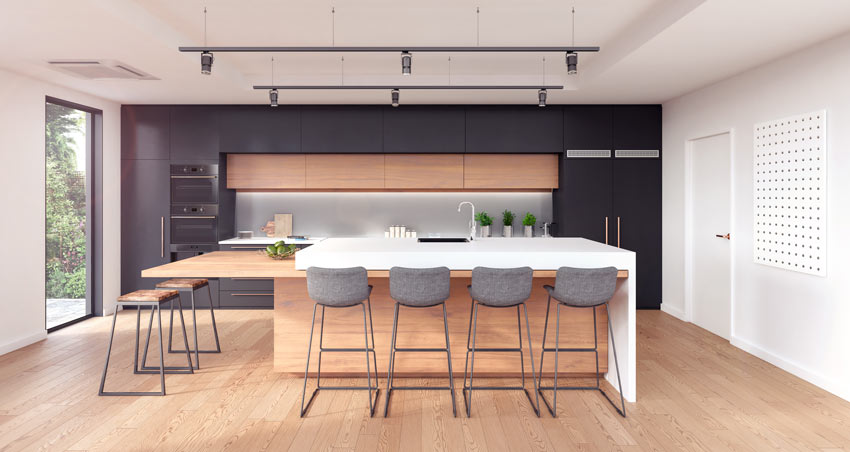 Le cucine nere e rovere con grande isole centrale, ideale in una casa moderna.