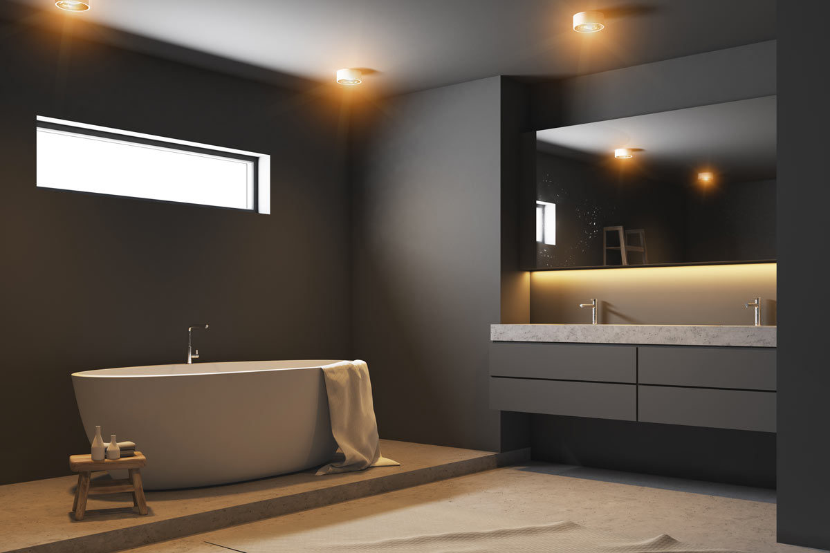 Splendido bagno grigio scuro con illuminazione soffusa.