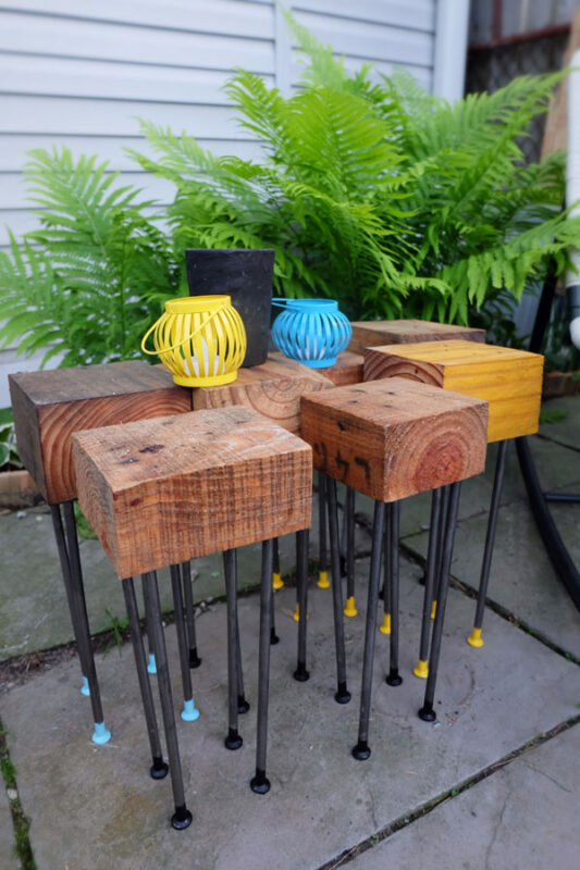 DIY wood and metal patio tables with colorful legs (via www.creativeinchicago.com)