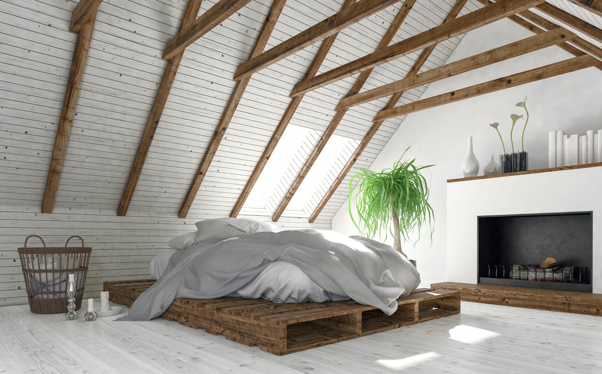 Bellissimo letto con bancali in una camera stile rustico.