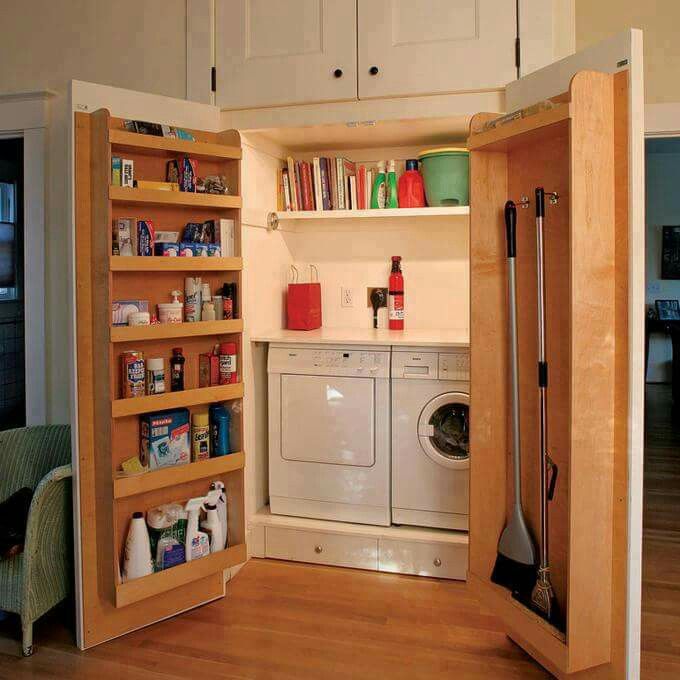 Large cabinets hiding laundry with extra functional doors for extra storage