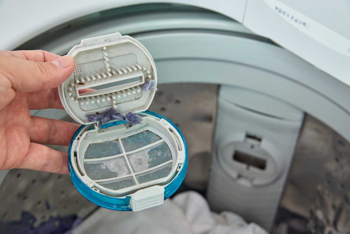 pulire filtro lavatrice con trucco del barattolo