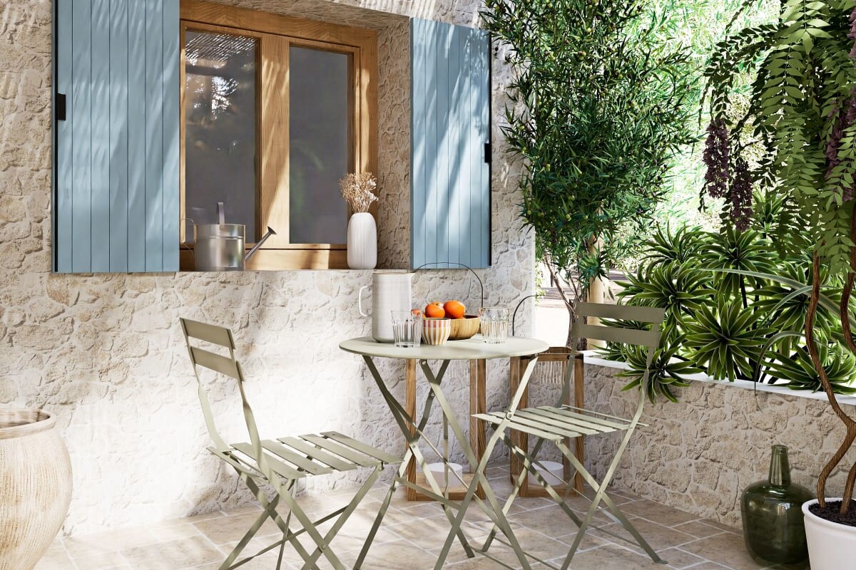 Tavolo GUINGUETTE verde kaki in un ambiente outdoor estivo