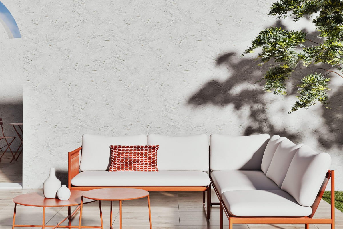 Salotto da giardino AIREL Maisons du Monde color terracotta su terrazzo luminoso