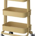 Carrello compatto RÅSKOG IKEA beige giallo organizzato in un ambiente domestico
